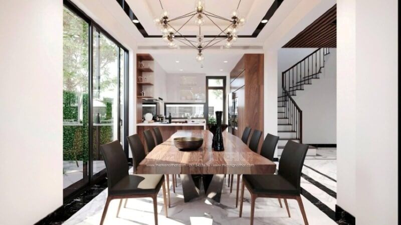 Một bàn gỗ nguyên khối được làm từ óc chó sẽ làm nên một điểm nhấn ấn tượng trong bố trí nội thất của phòng ăn.
